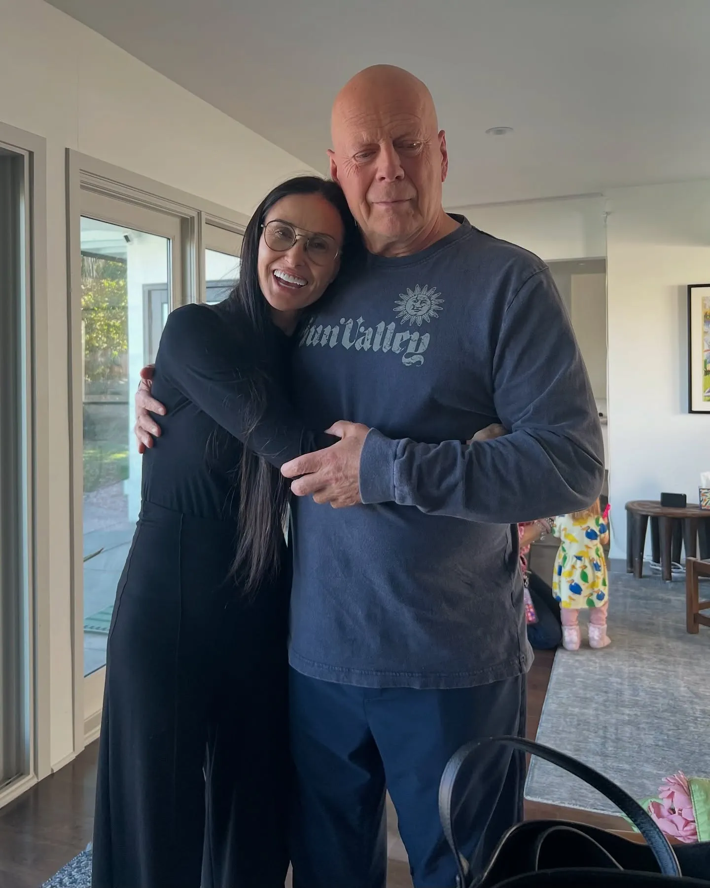 Demi Moore embracing Bruce Willis.