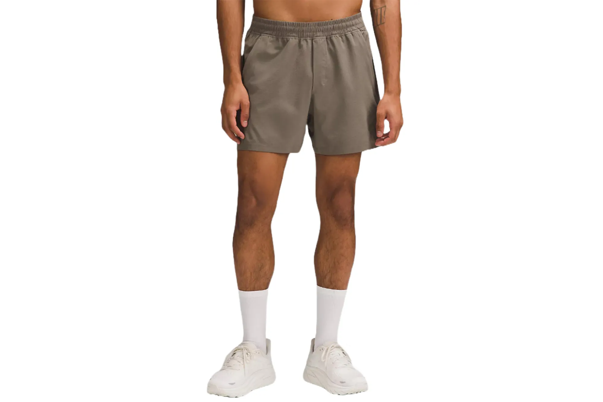 A model in brown lululemon shorts