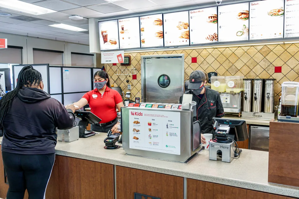 Employee check out and food ordering counter at a Chick-fil-A in Macon, Georgia.