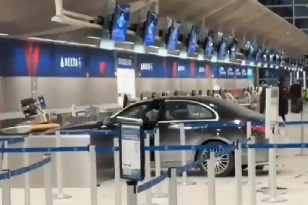 A black sedan crashed into the Delta check-in counter at the McNamara Terminal at Detroit Metro Airport.