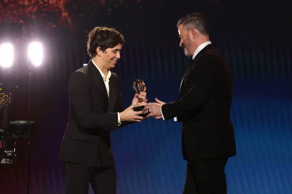 Marcello Hernández hands Jimmy Kimmel the Best Talk Show Award for 