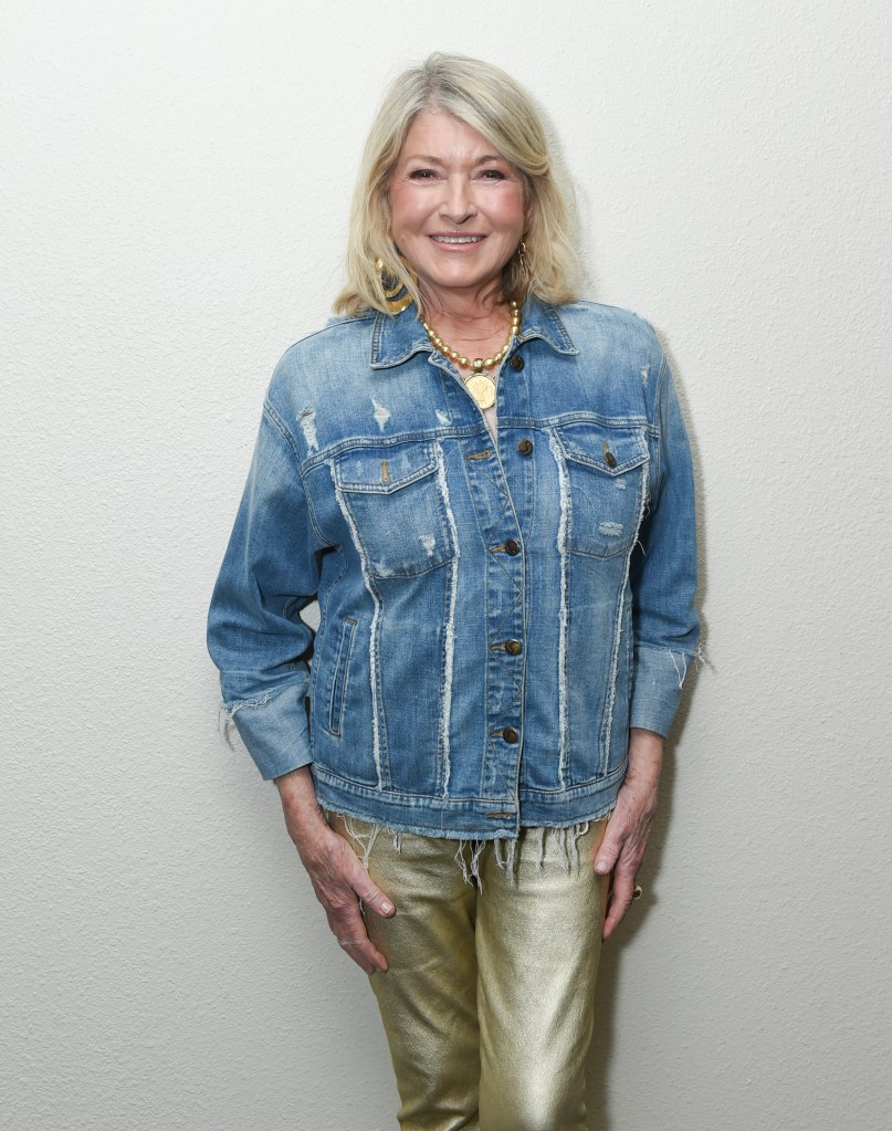 Martha Stewart in a distressed denim jacket and gold pants.