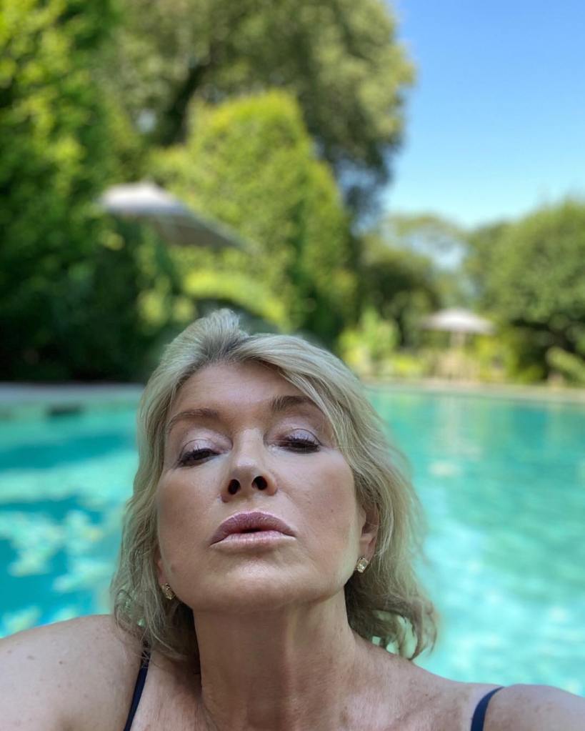 Martha Stewart looking up at the camera while in a pool.
