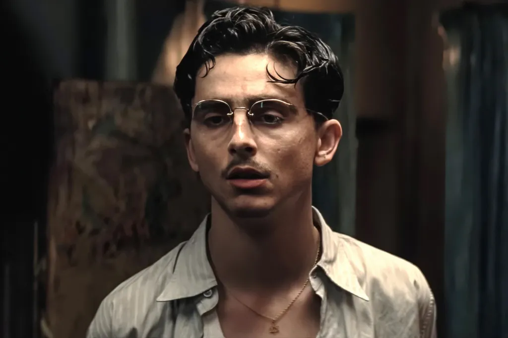 Timothée Chalamet as Marty Supreme in a close-up film still.