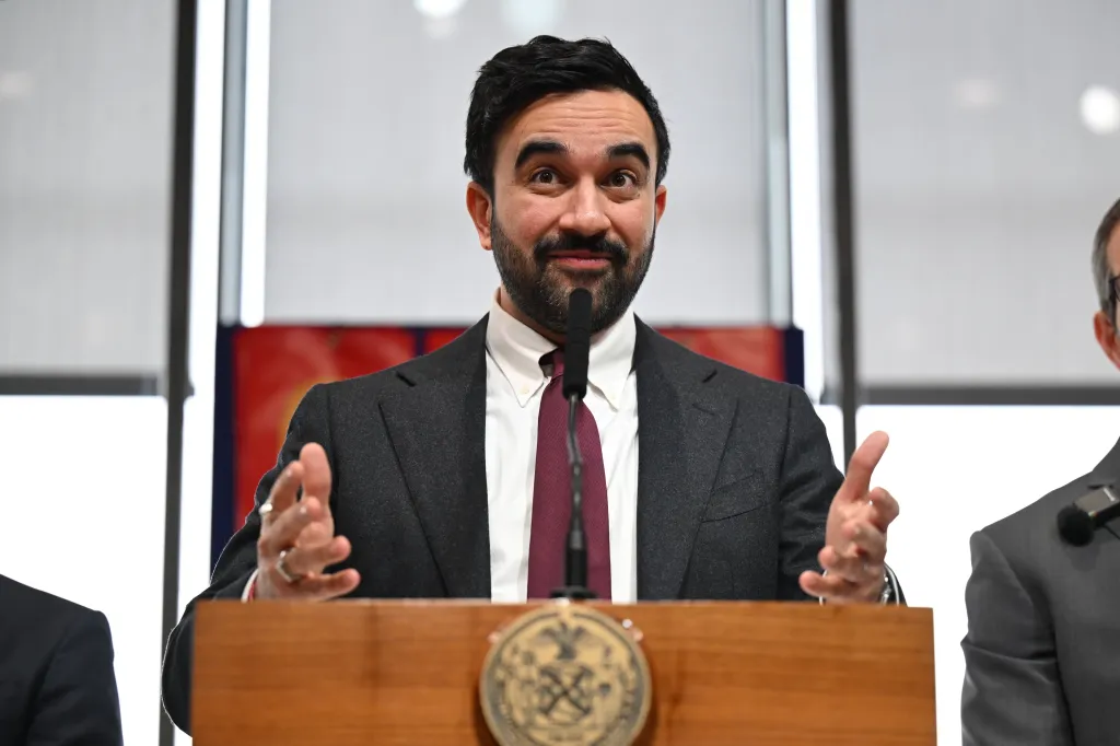 Mayor Zohran Mamdani making a junk fees-related announcement at a press conference.