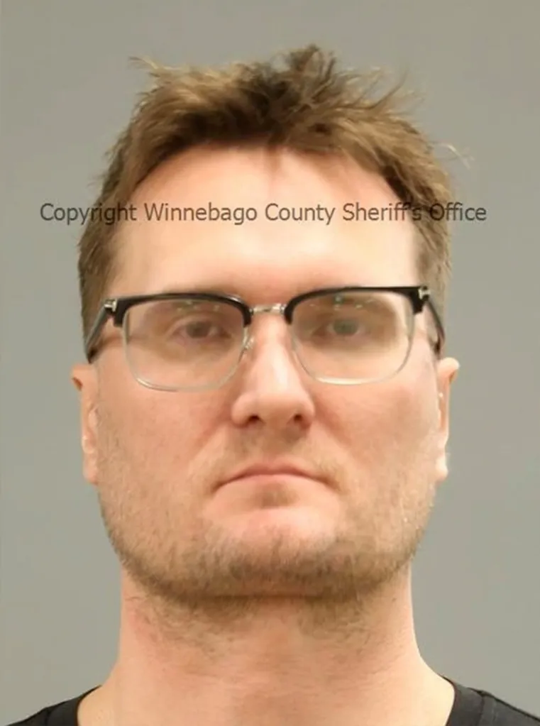 Mugshot of Michael David McKee, 39, wearing glasses.