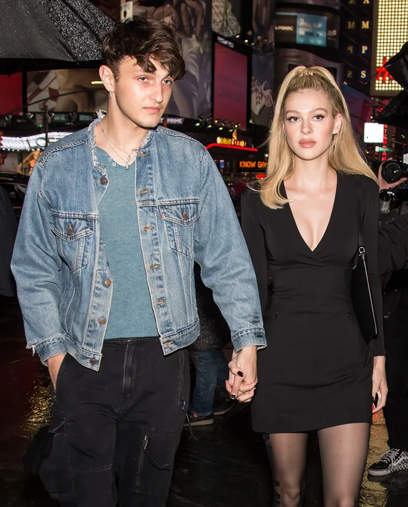 Model Anwar Hadid and actress Nicola Peltz holding hands during New York Fashion Week.