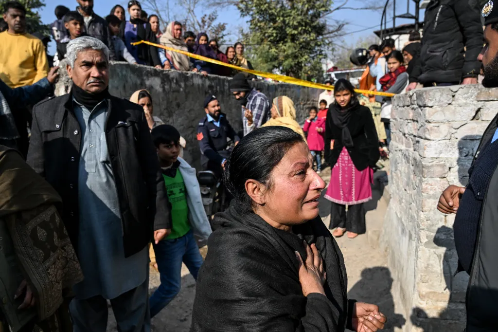 Mourners react after the death of their relatives following the gas cylinder explosion.