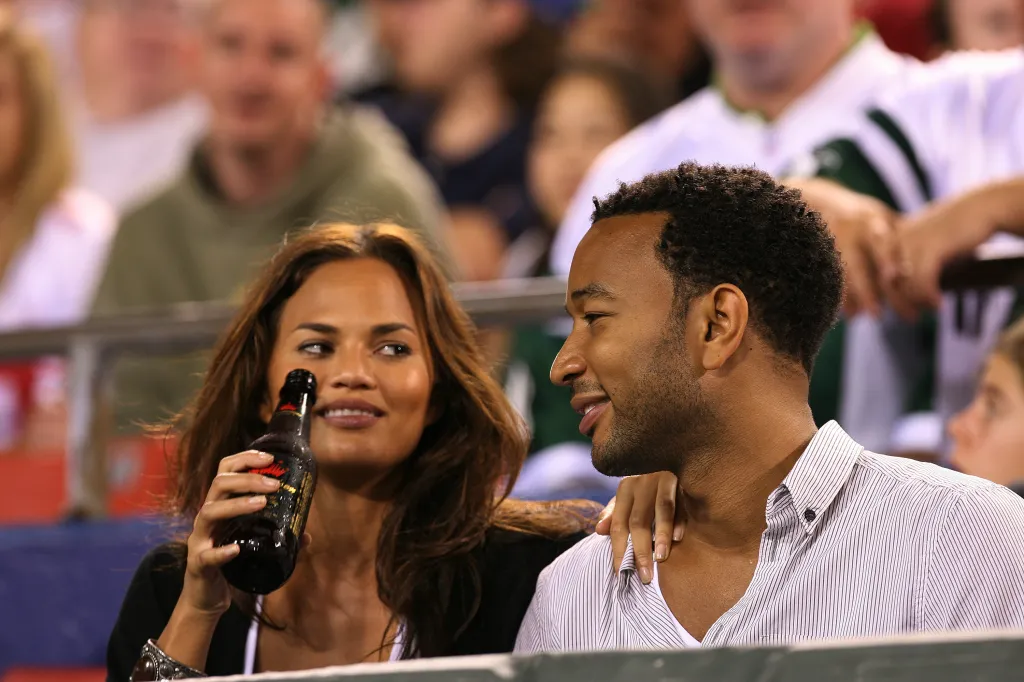 Musician John Legend and model Chrissy Teigen at a New York Jets vs. New York Giants game.
