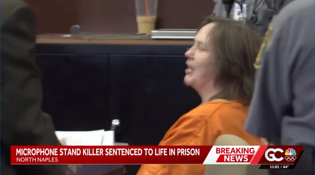 Cook shouts from her seat in the courtroom before a judge kicked her out.