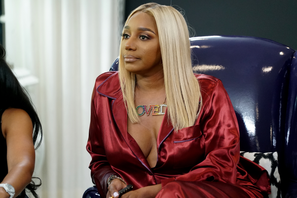 NeNe Leakes in a red satin top and a rainbow 