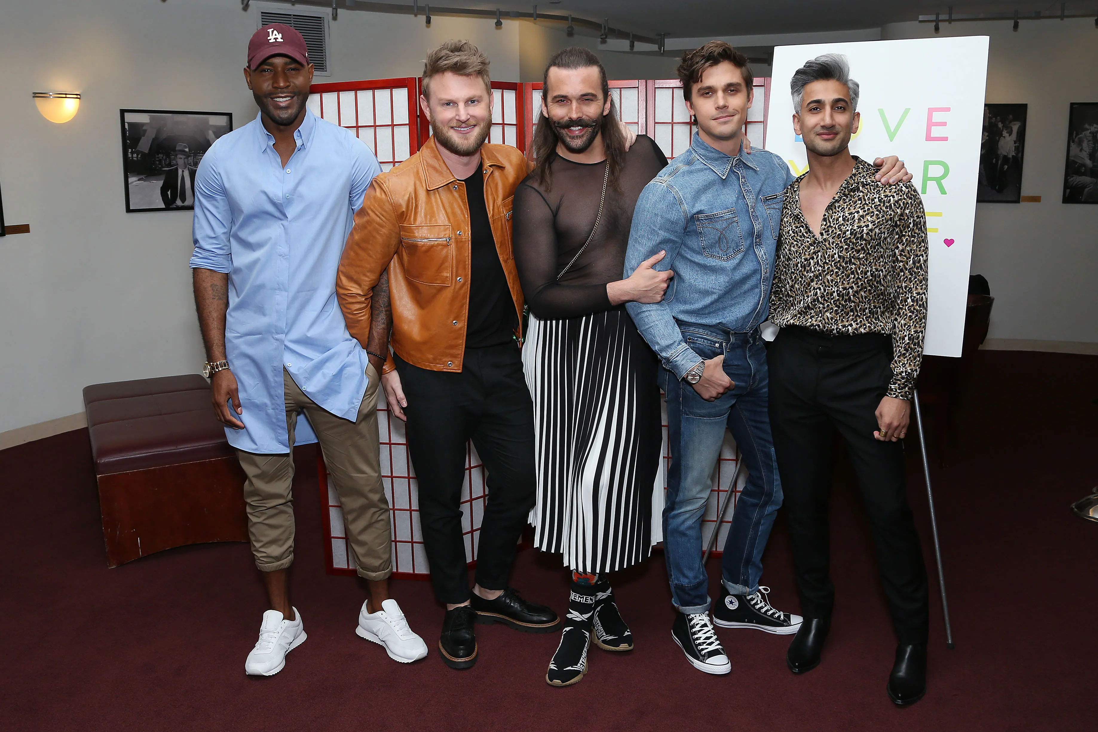Karamo Brown, Bobby Berk, Jonathan Van Ness, Antoni Porowski, and Tan France posing together.
