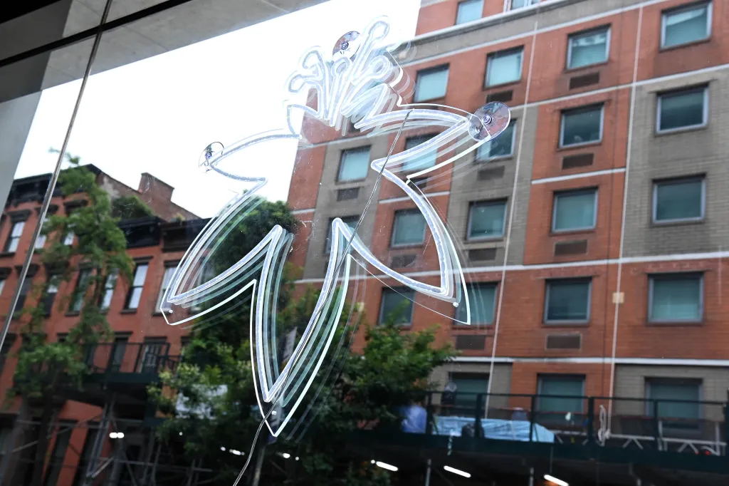 Marijuana leaf logo on the window of The Flowery dispensary.