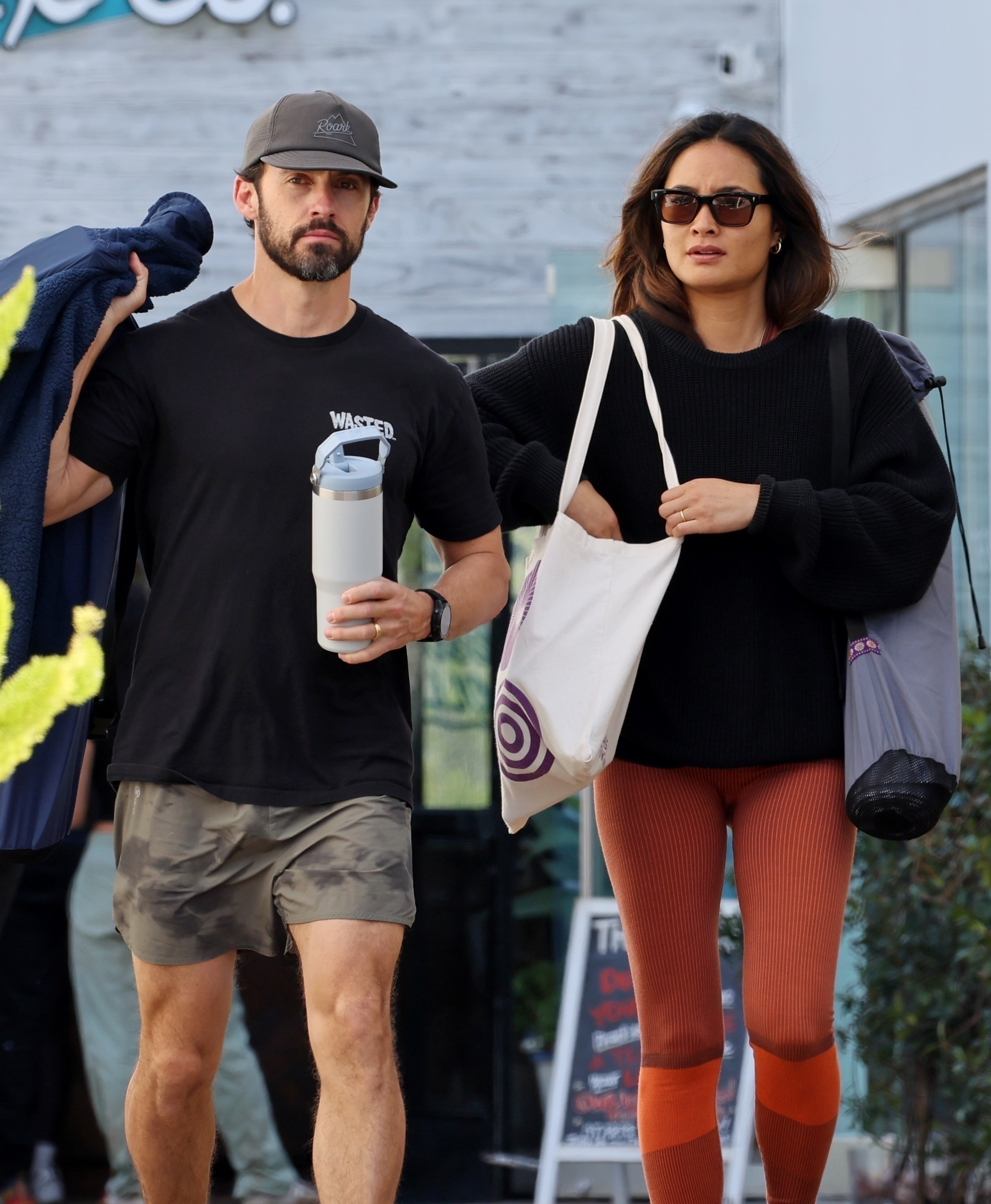 Milo Ventimiglia and Jarah Mariano walking together after a yoga class.