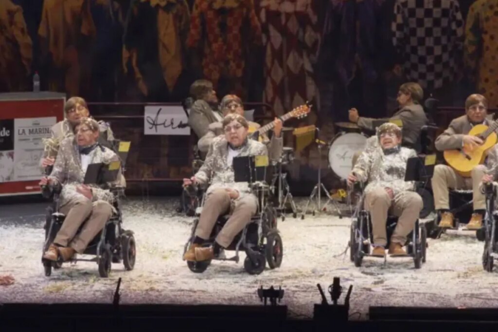Spanish carnival group dress like Stephen Hawking, zip around in wheelchairs in bizarre performance to raise ALS awareness