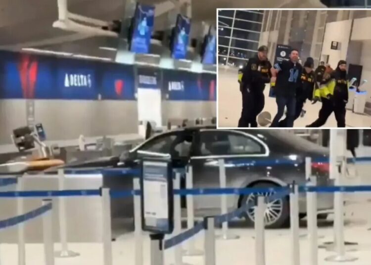 Driver crashes into Detroit Metro Airport terminal— hauled away by police in shocking scene
