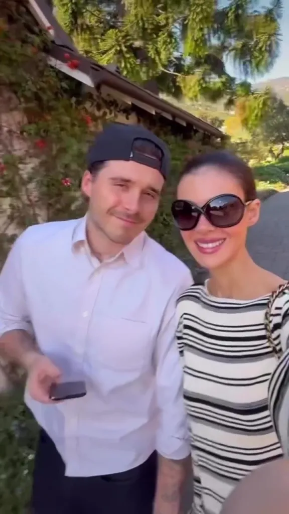 Nicola Peltz and Brooklyn Beckham smiling for a photo.