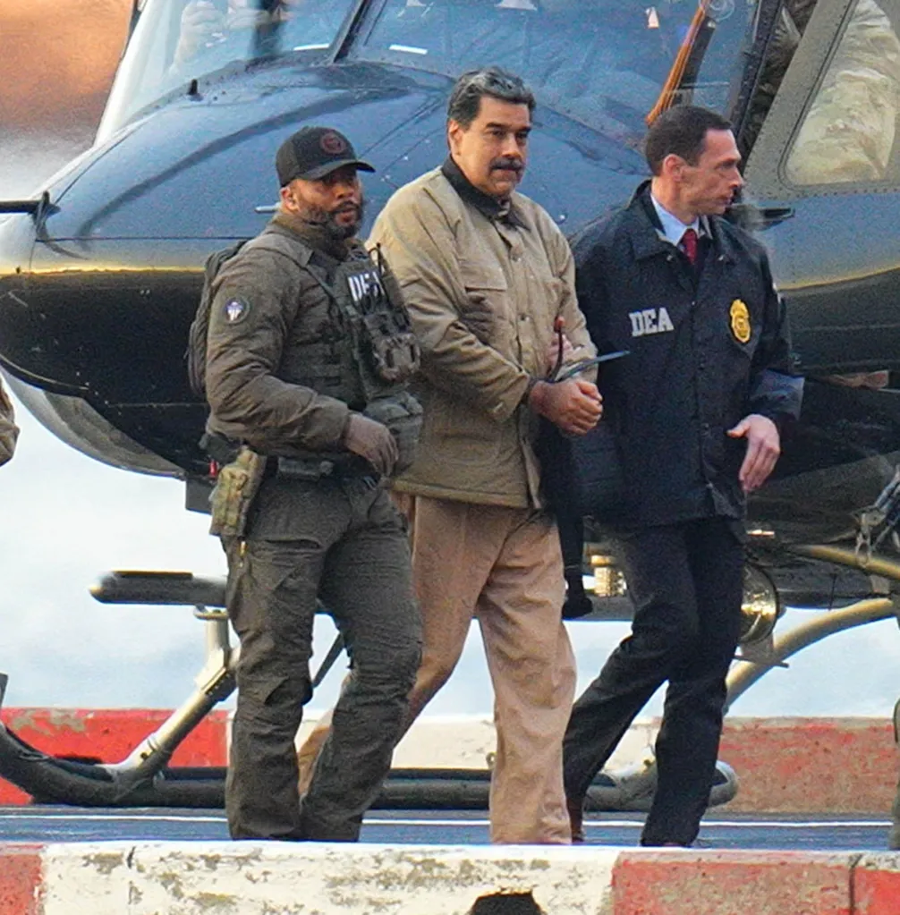 A handcuffed Nicolas Maduro is escorted on a Manhattan helipad before his court appearance on Jan. 5, 2026.