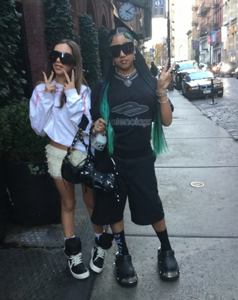 North West and another child in NYC, both dressed in Balenciaga and designer Crocs.
