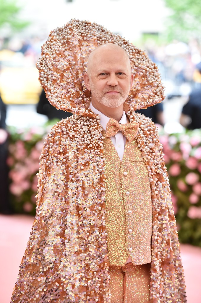 Ryan Murphy, in a coral sequined suit and cloak, at the 2019 Met Gala.