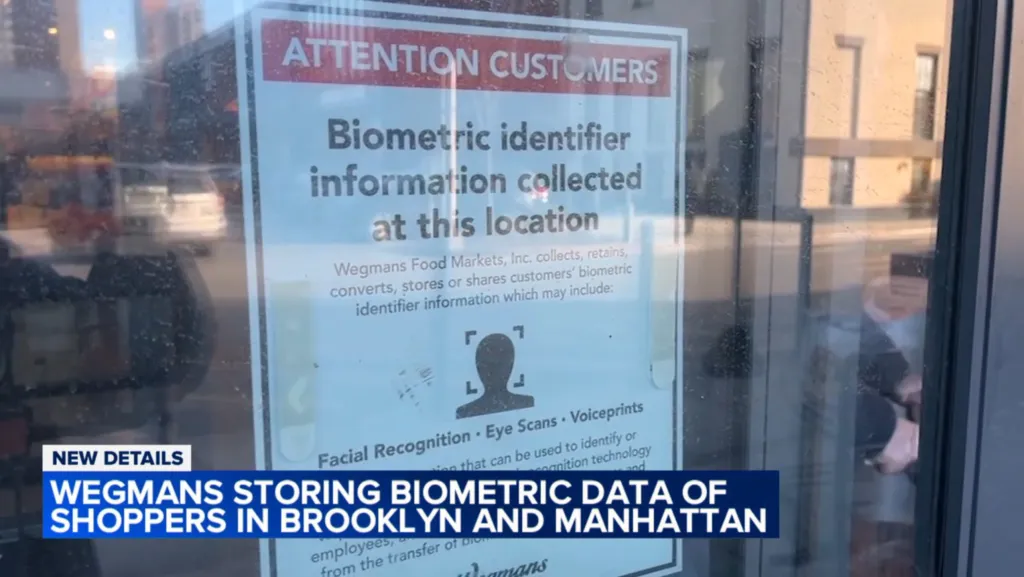 A sign on a store window reads 