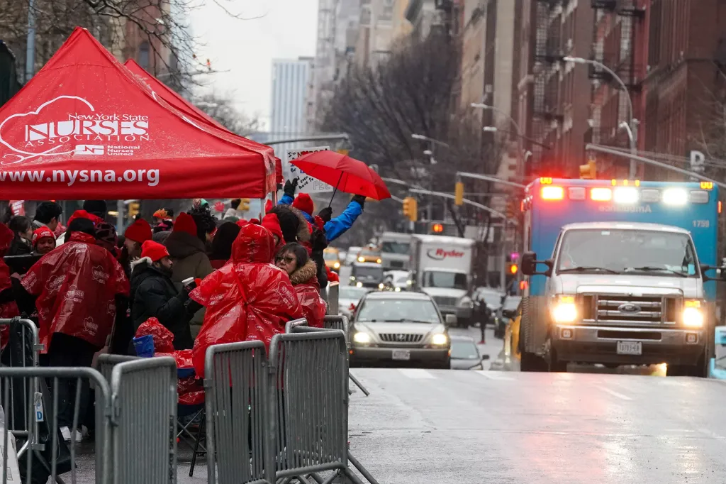 nurses on strike picketing outside hospital