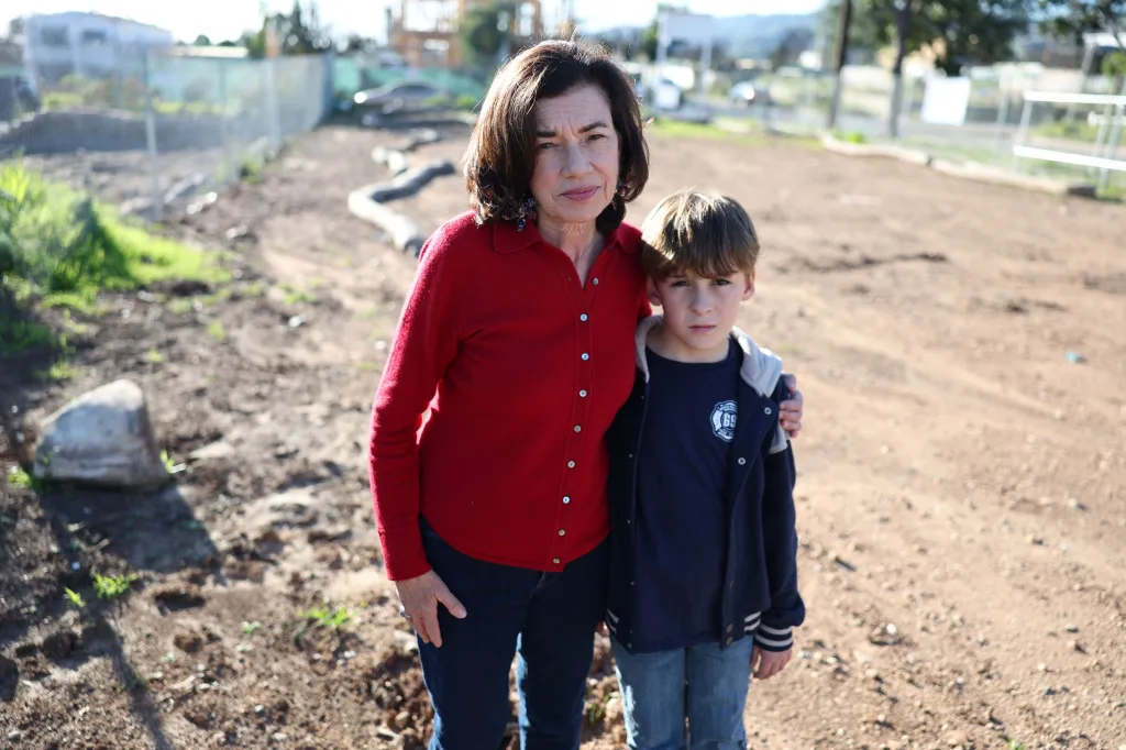 Nina Made and her son Andrew standing on their family plot in the Pacific Palisades.