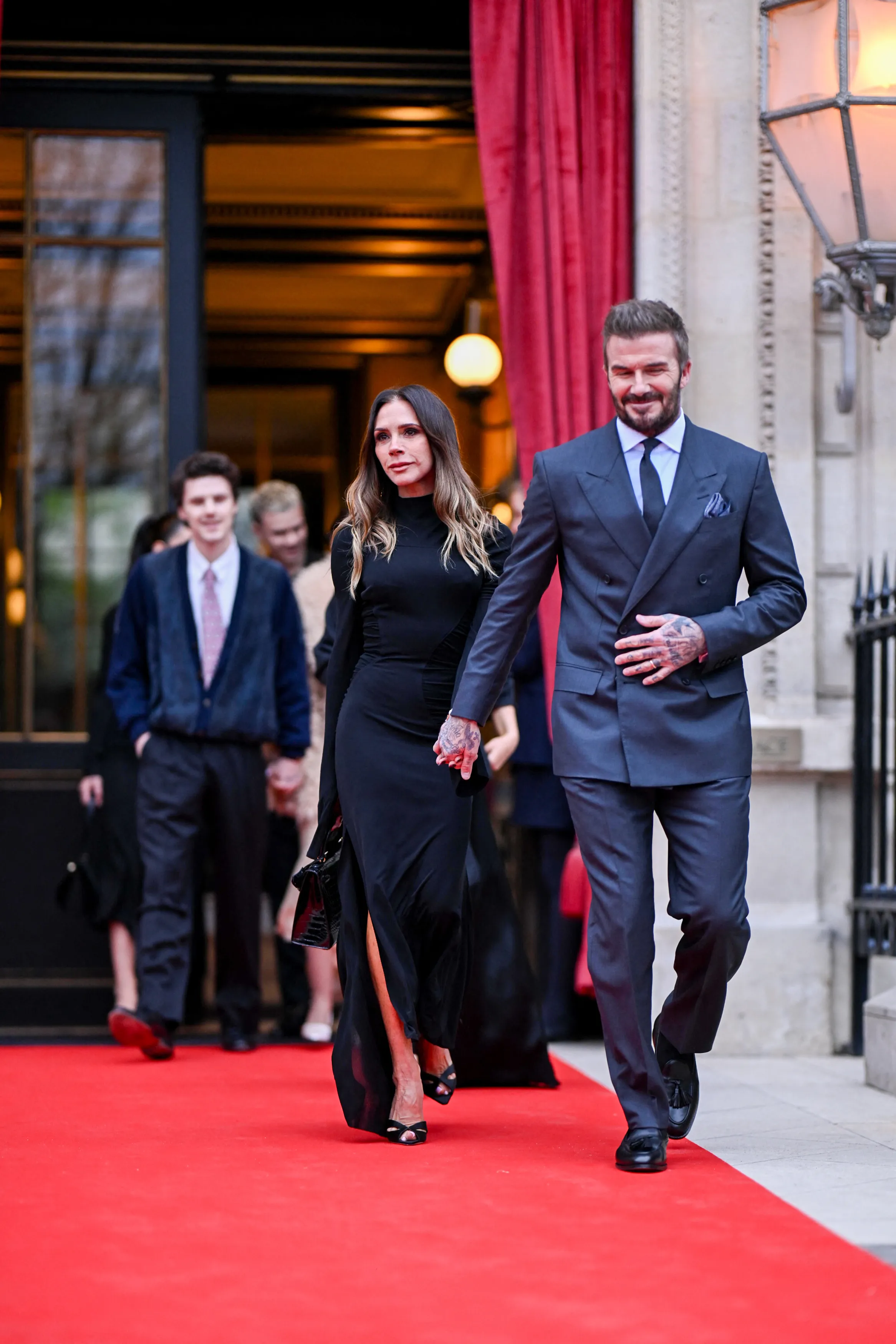 Victoria Beckham, accompanied by her family, leaves the Hotel La Réserve