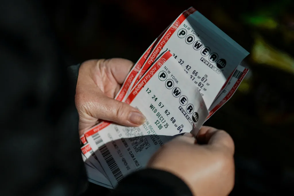 A person holds Powerball lottery tickets for the $1.25 billion jackpot.