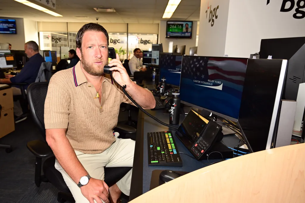 David Portnoy on the phone at a desk with computers displaying
