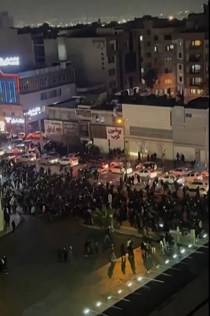 Protestors march in the Iranian capital Tehran on January 8, 2026.