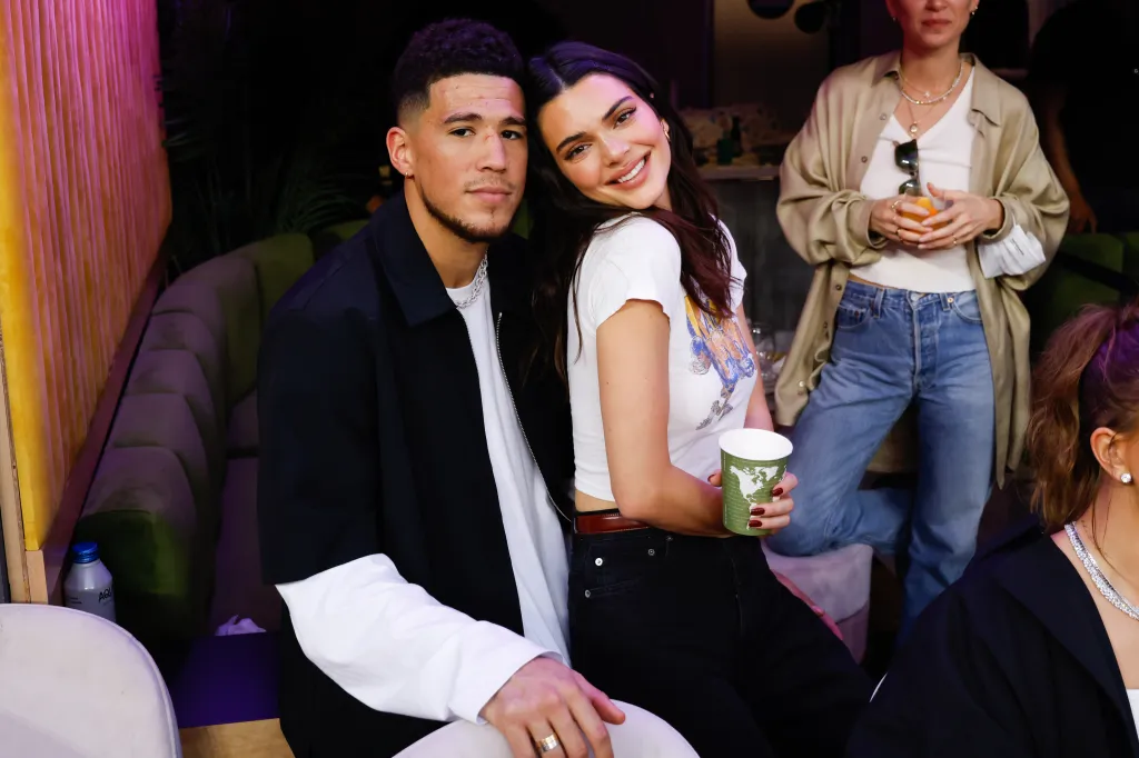 Devin Booker and Kendall Jenner posing together at Super Bowl LVI.