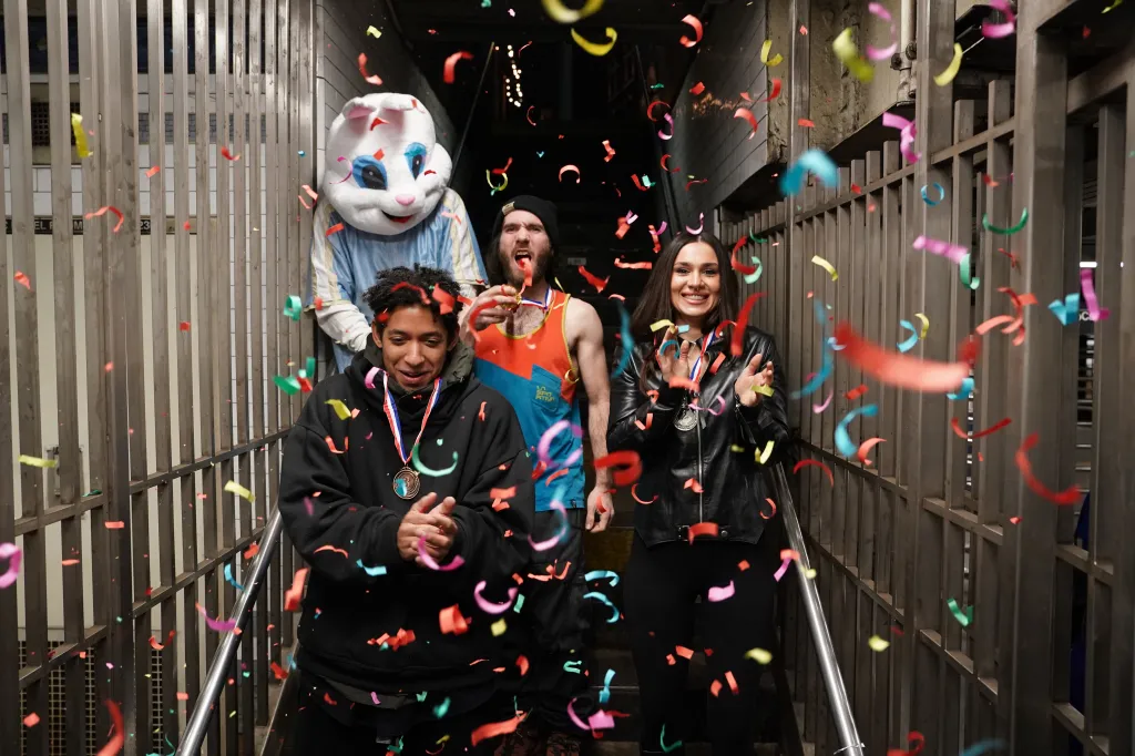 The trio celebrates with confetti.