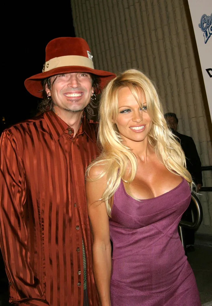 Pamela Anderson and Tommy Lee posing together.
