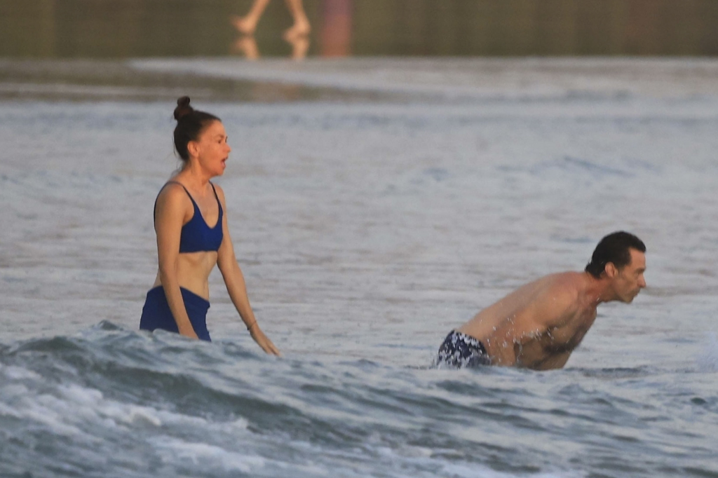 Hugh Jackman and Sutton Foster enjoying a romantic sunset on a Costa Rican beach.