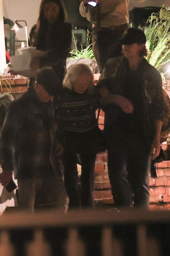Tippi Hedren, assisted by her daughter Melanie Griffith, leaves a birthday celebration in Los Angeles.