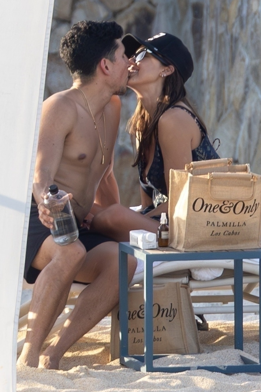 Jessica Alba and Danny Ramirez kissing on a beach in Cabo.