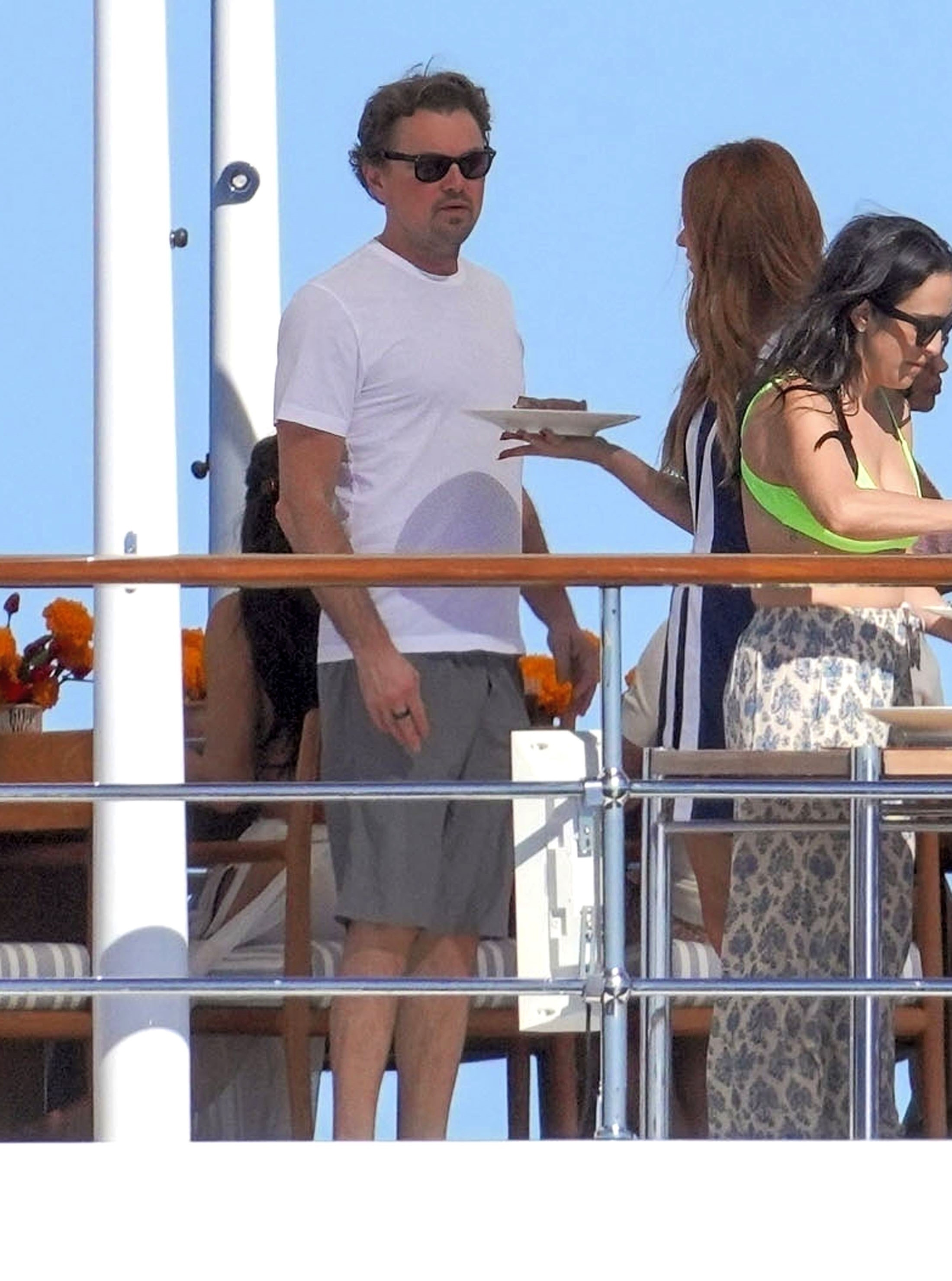 Leonardo DiCaprio and Vittoria Ceretti attending a brunch on Jeff Bezos's yacht.