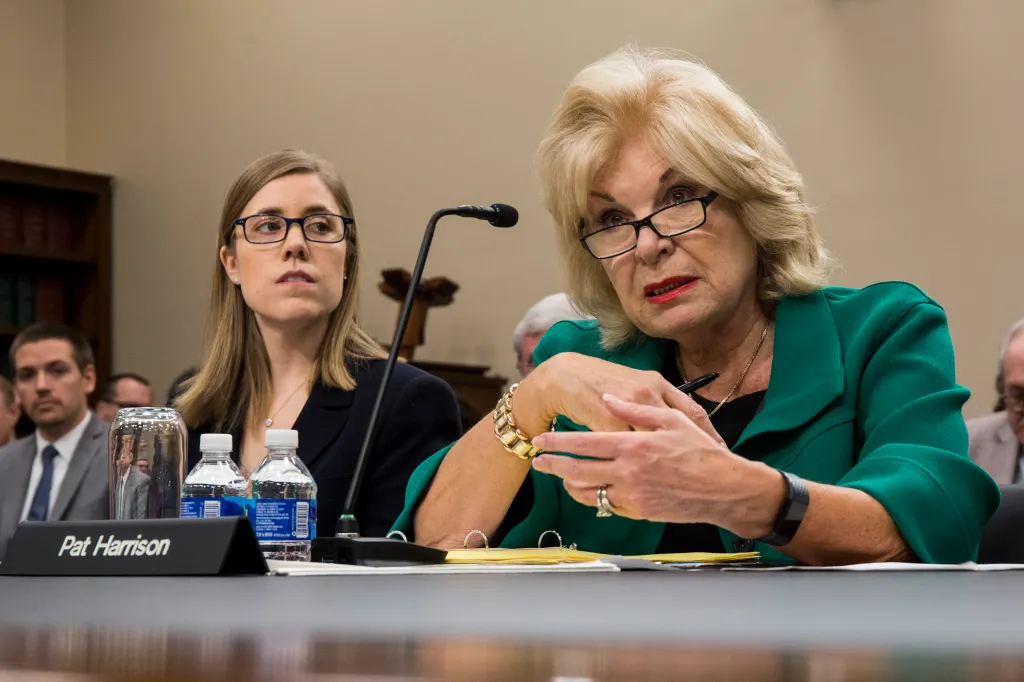 Patricia de Stacy Harrison testifies at a House subcommittee hearing with Anne Brachman listening.
