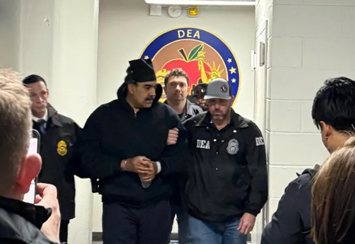 President Nicolas Maduro escorted by agents inside DEA headquarters in Manhattan.