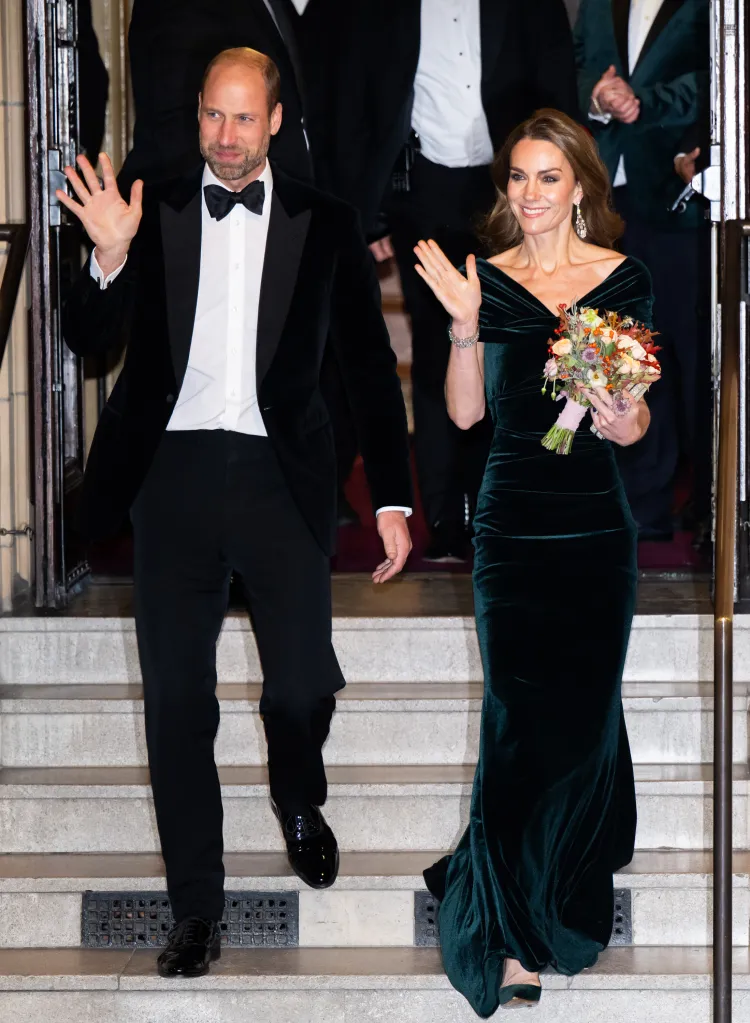 Prince William and Catherine, Princess of Wales, wave as they depart the Royal Variety Performance.