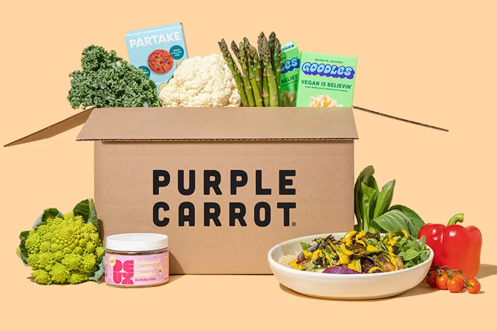 A person serving Mafaldine Pasta with Melted Leeks & Herb Garlic Cashew Cream from a green pan into a white bowl.