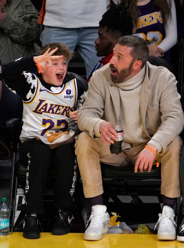 Ben Affleck and Samuel Garner Affleck watching a basketball game.