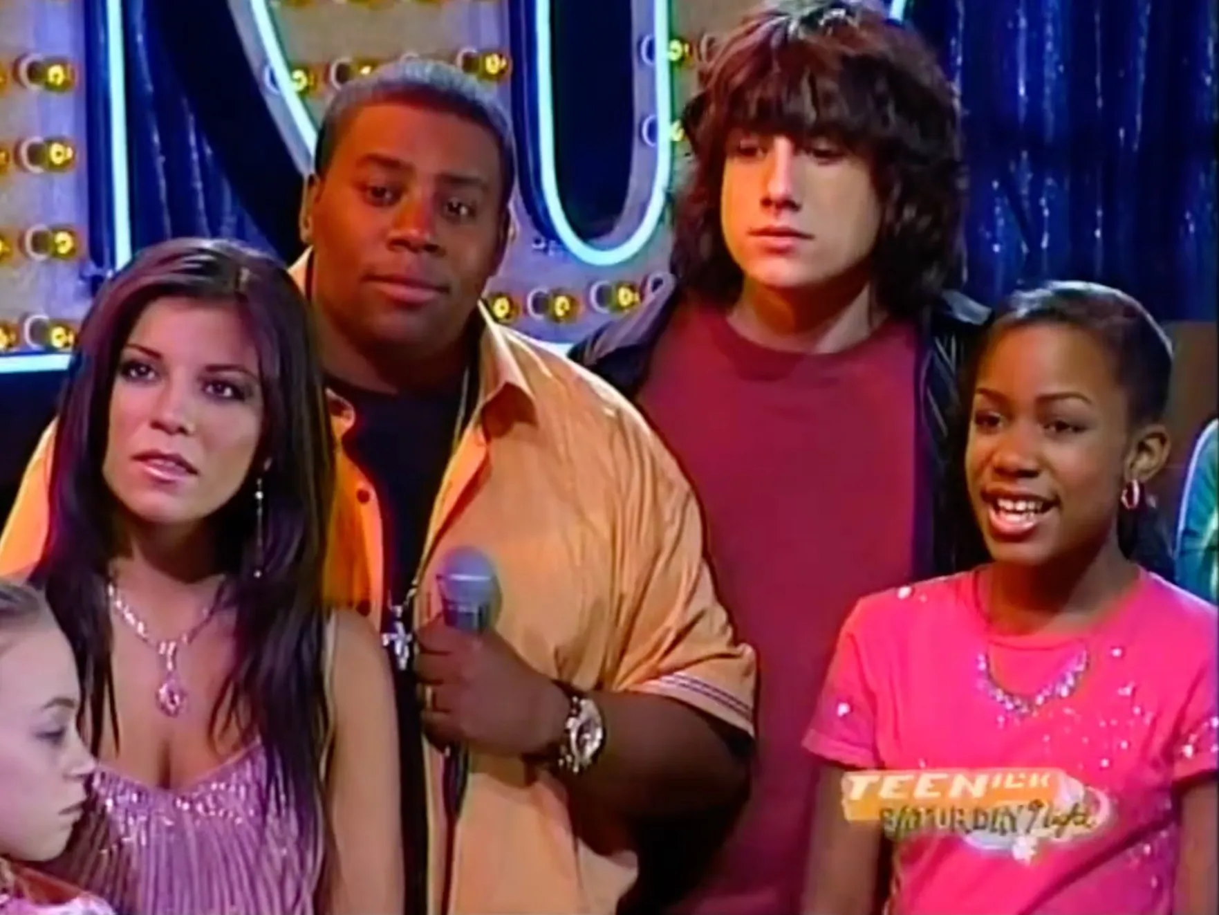 Kianna Underwood in a pink shirt next to Kenan Thompson, during the All That reunion.
