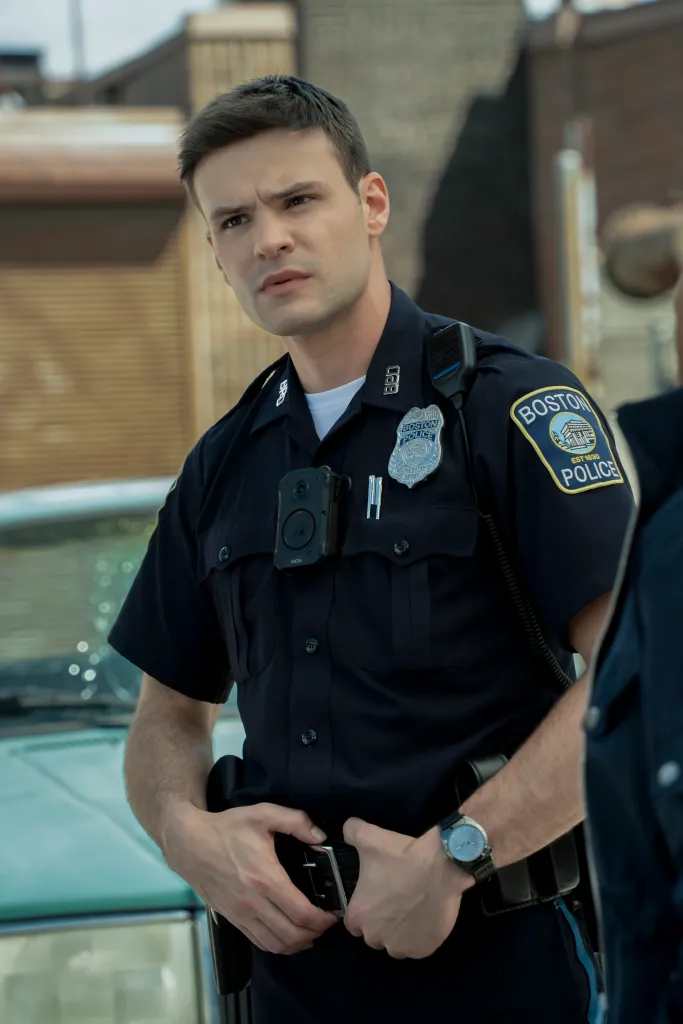 Mika Amonsen as Sean Reagan, a police officer in uniform with a Boston Police patch.