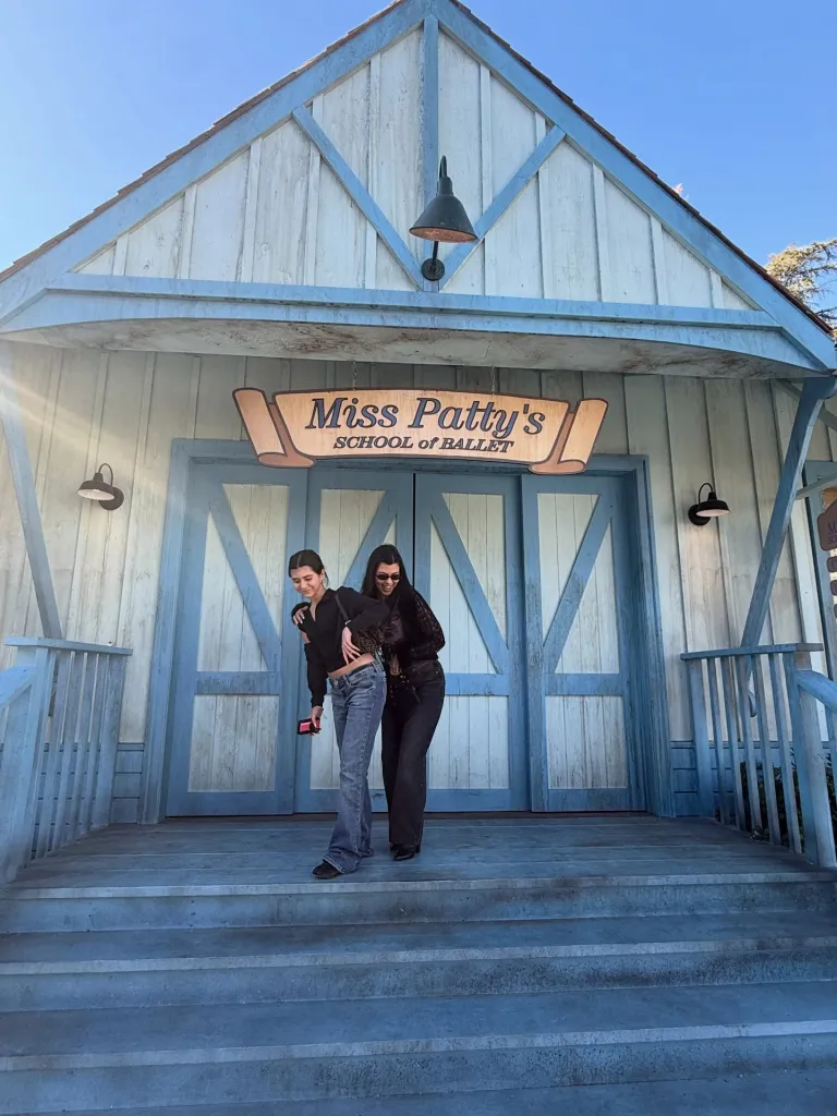 Kourtney Kardashian and Penelope Disick posing together on the steps of Miss Patty's School of Ballet.
