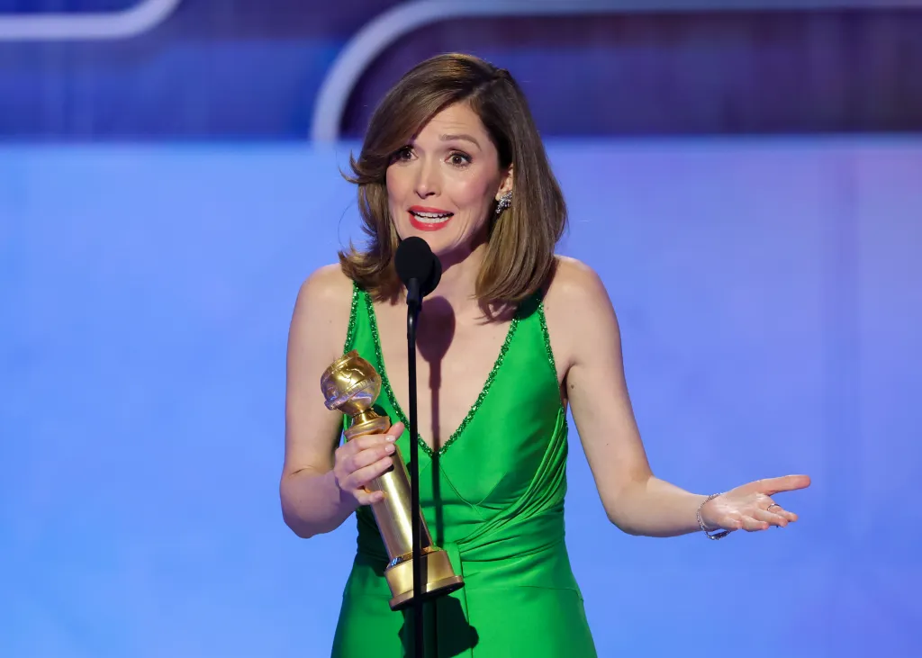 Rose Byrne accepting an award at the Golden Globes.