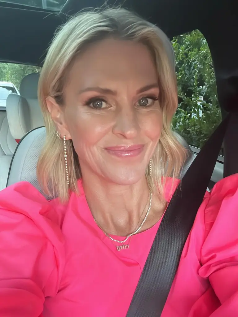 Kelly Noonan Gores in a hot pink top.