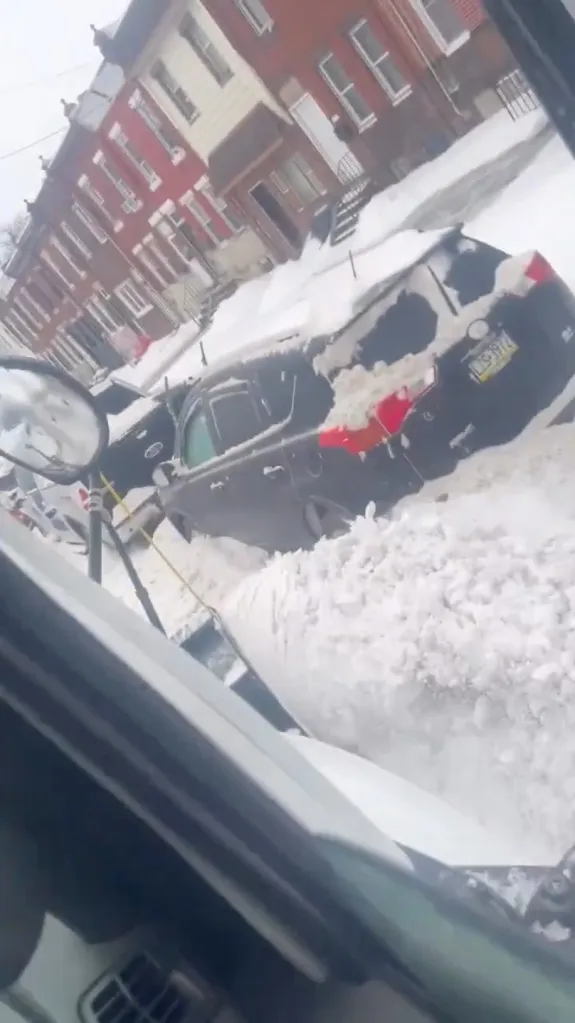 The footage captured the snowplow operator driving through Philadelphia's Kensington neighborhood as he piled even more heavy snow against the vehicles that were already buried on the city streets.