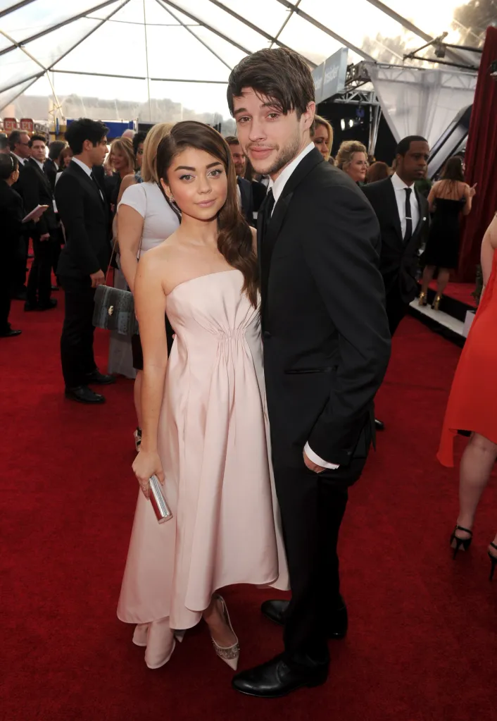 Sarah Hyland in a light pink strapless dress and Matt Prokop in a black suit attend the 20th Annual Screen Actors Guild Awards.